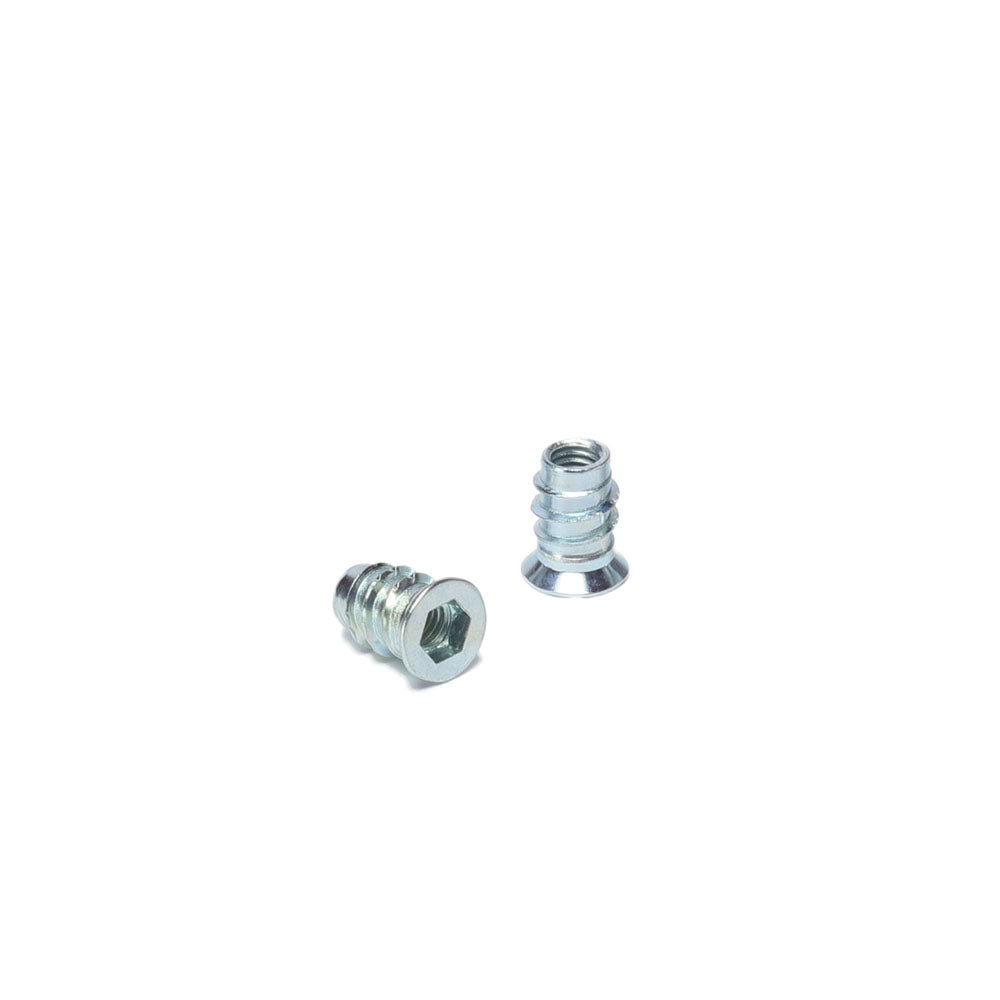 Two M4 threaded inserts for wood, made of steel with a zinc plating, displayed on a white background